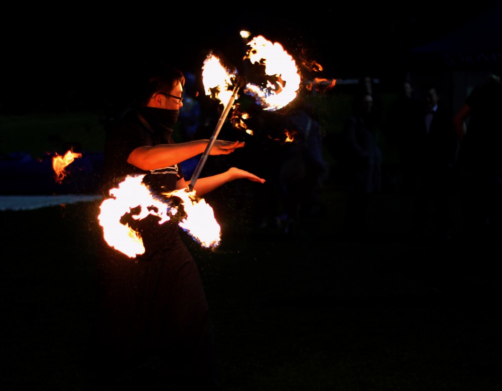 A member of the Monash Club of Juggling and Fire Twirling shows off his skills